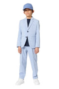 Child wearing a light blue suit and cap on a white background