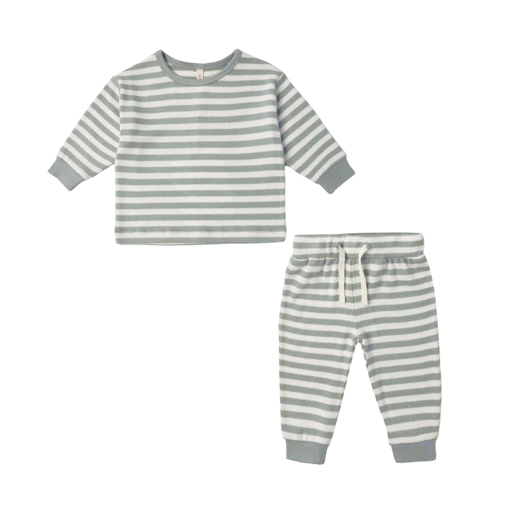 Striped pajama set with long-sleeve top and pants on a white background