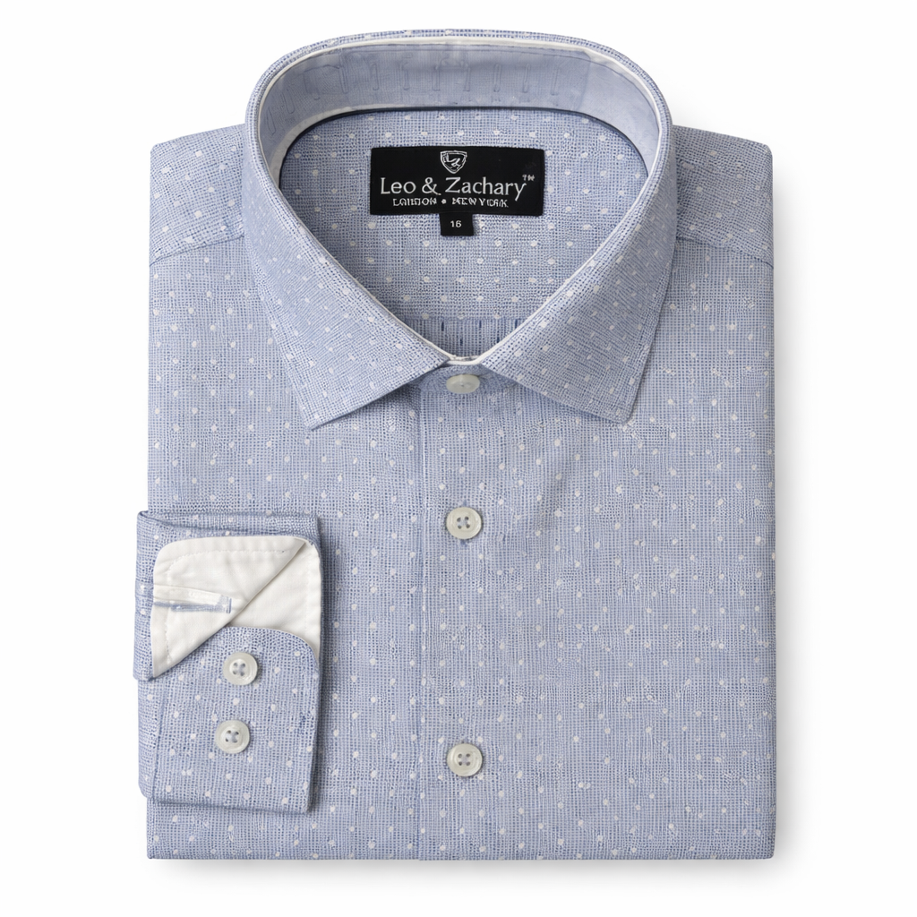 Folded blue dress shirt with white polka dots and 'Leo & Zachary' label on a white background