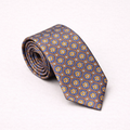 Rolled-up patterned tie on a white background