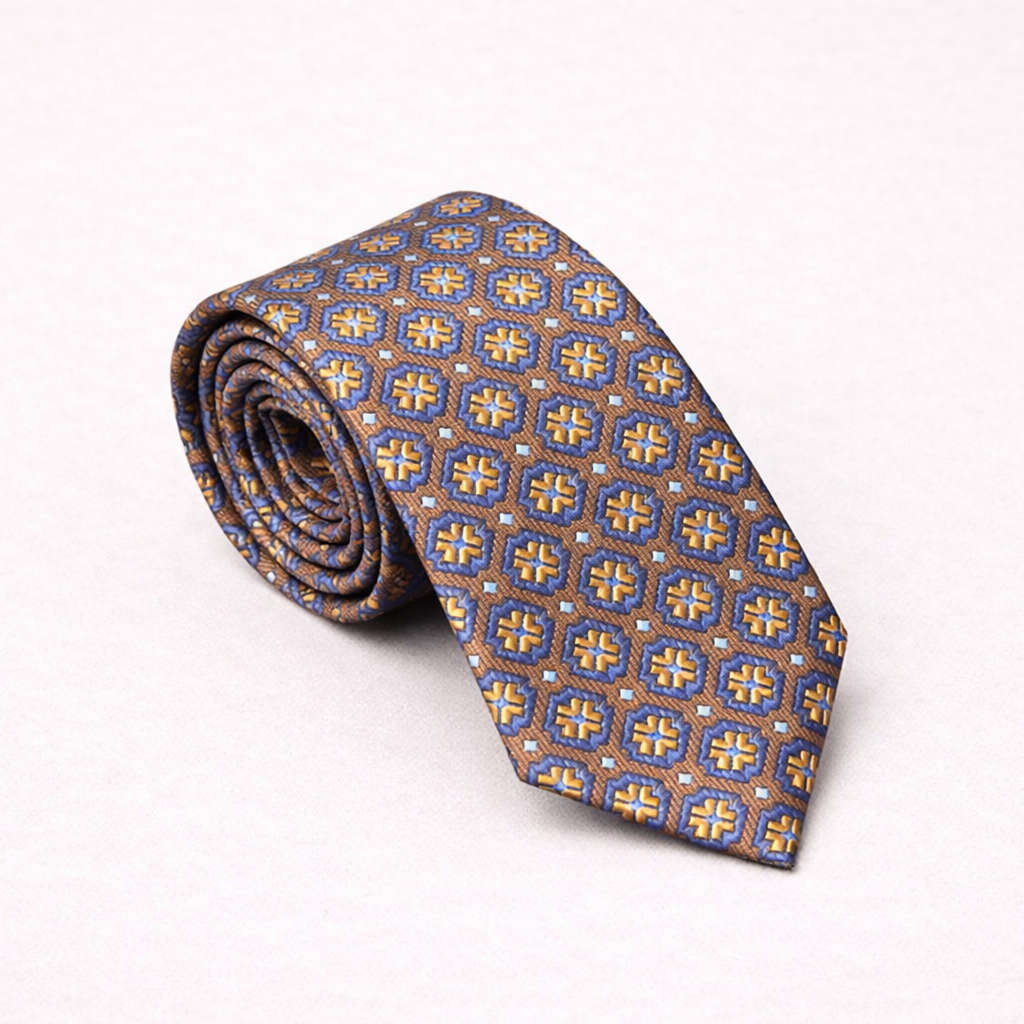 Rolled-up patterned tie on a white background